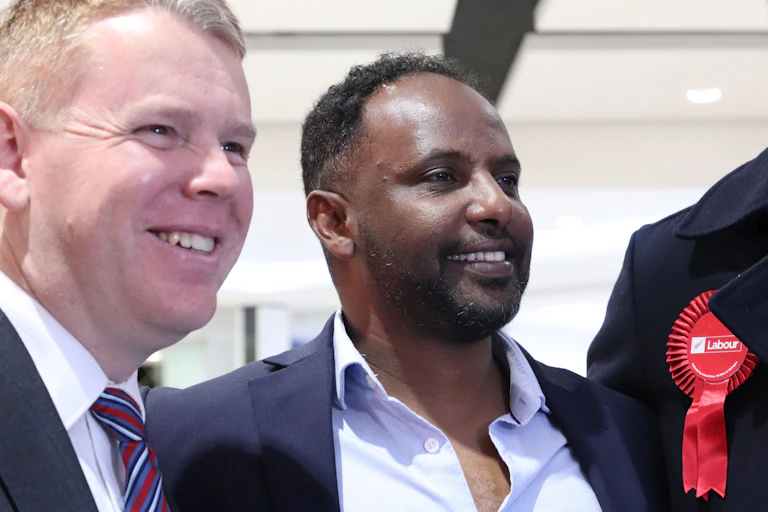Two men smiling