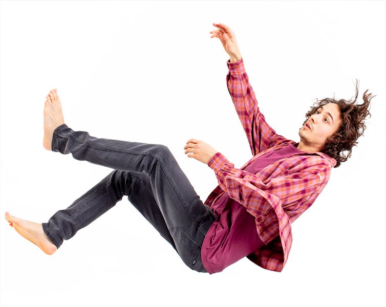 Promo image, a man falls through the sky.