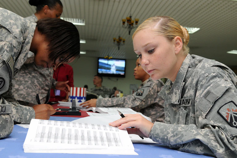 U.S. military members fill out their absentee ballots