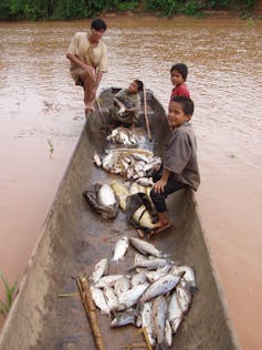 Tsimane man and boys after fishing.