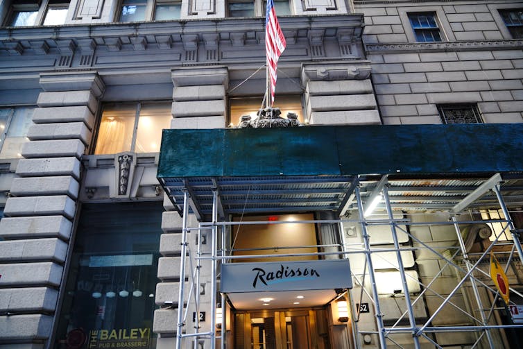 A New York City hotel on Wall Street converted to a homeless shelter.