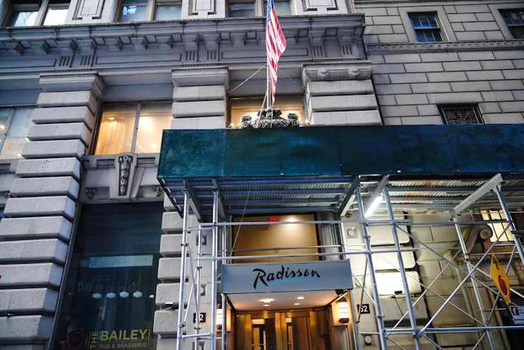 A New York City hotel on Wall Street converted to a homeless shelter.