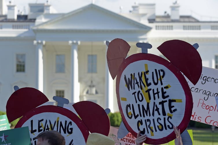 protest signs outside White house