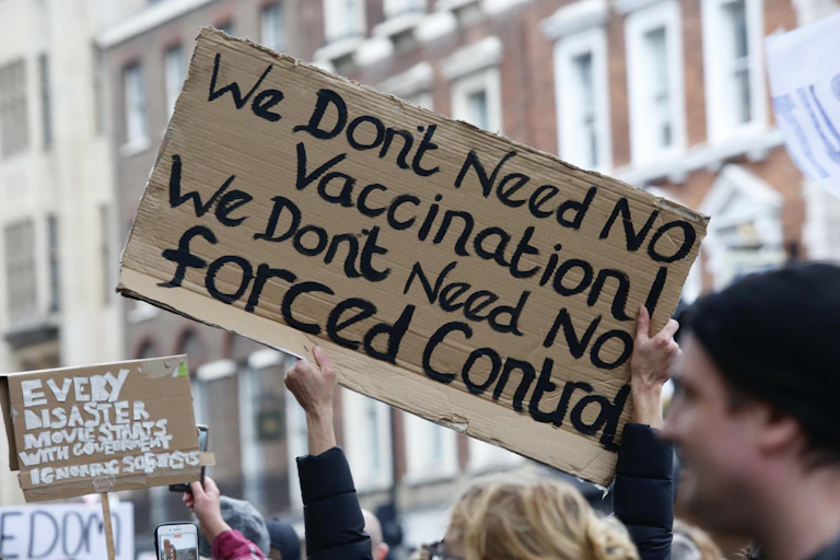 Members of StandUpX stage a protest against coronavirus (COVID-19) measures and vaccine in London