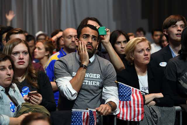 Sad people at a Hillary Clinton election party in 2016.