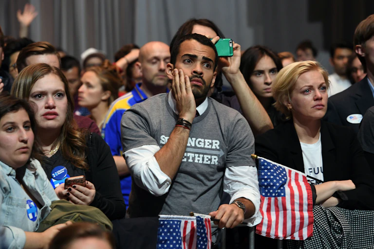 Sad people at a Hillary Clinton election party in 2016.