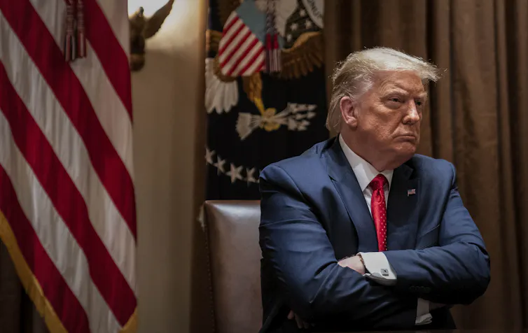 President Donald Trump listens during a White House meeting with Hispanic leaders on July 9 in Washington.