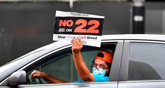 An app-based driver protests in a car caravan in Los Angeles on Oct. 22.
