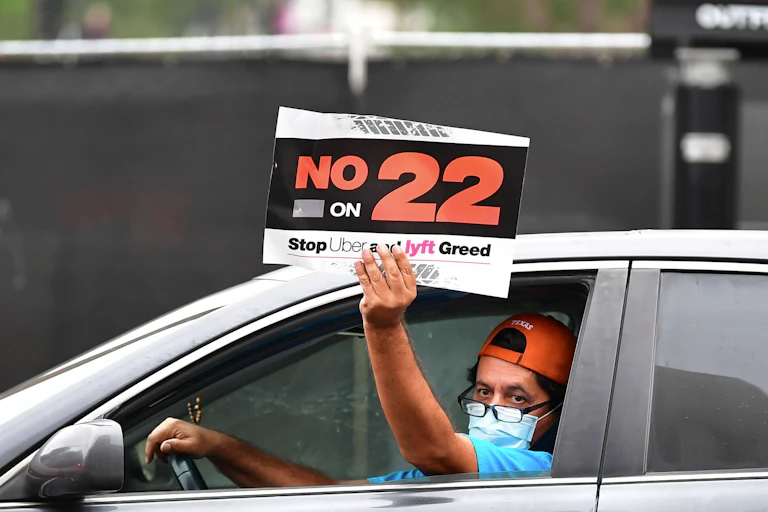 An app-based driver protests in a car caravan in Los Angeles on Oct. 22.