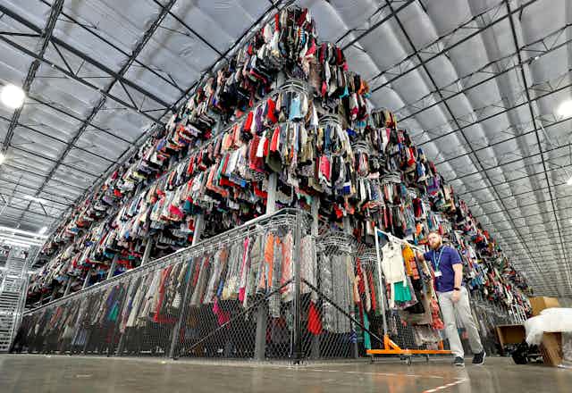 Thousands of garments are stored on a three-tiered conveyor system.