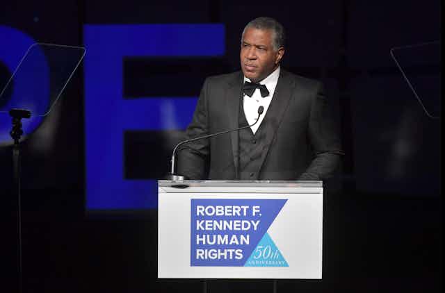 Robert F. Smith speaks at an awards ceremony.