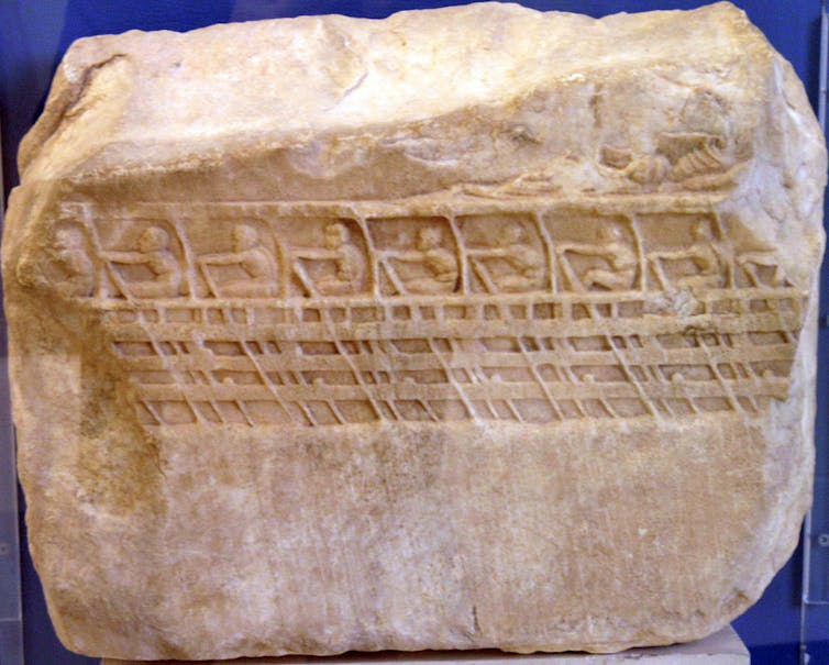 An ancient carving showing a Trireme showing three levels of rowers.
