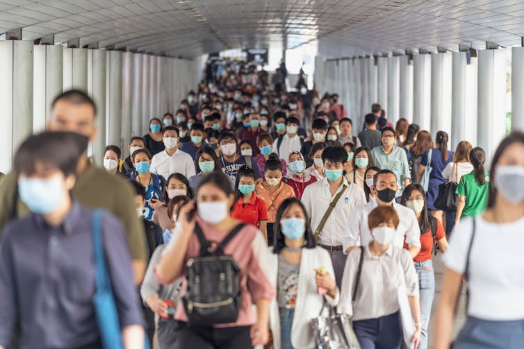 People wearing masks in a crowd