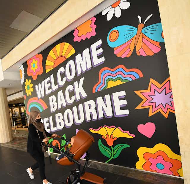 A mural reading Welcome Back Melbourne