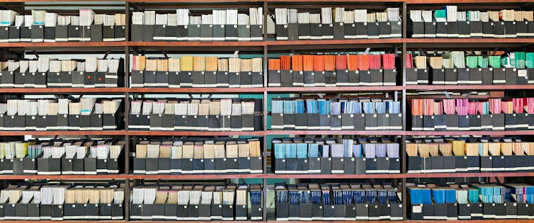 Library shelves full of academic journals.