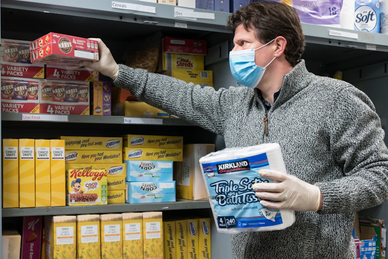 A volunteer at a food bank
