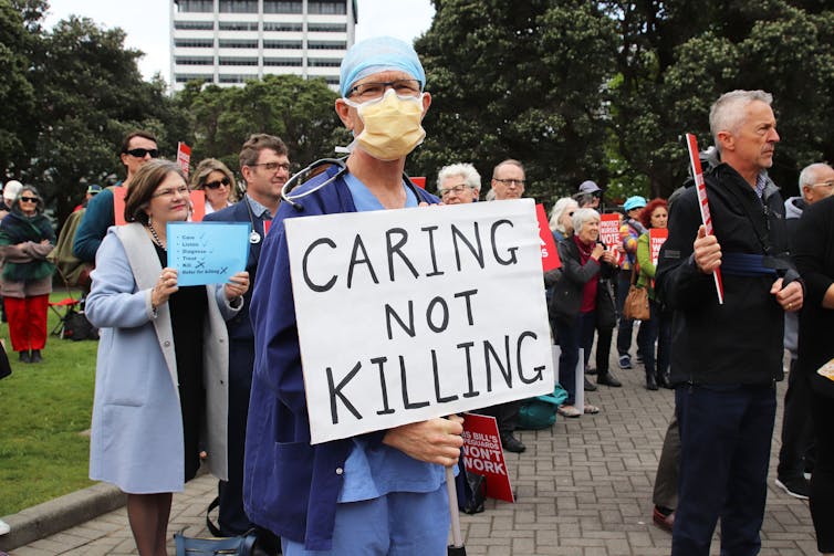 people protesting with placards