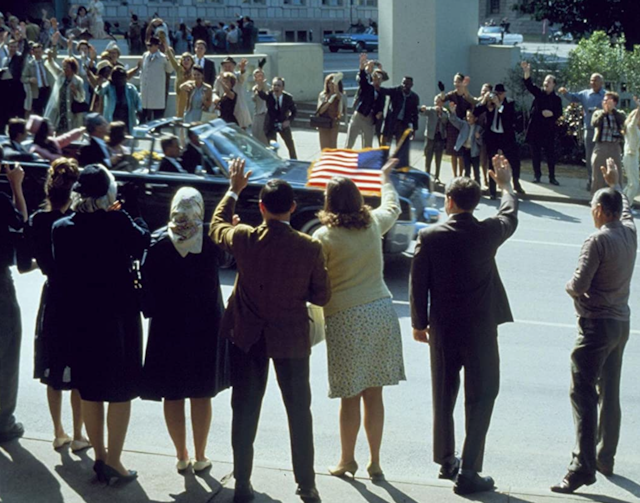 Crowds wave to US president in movie recreation.  