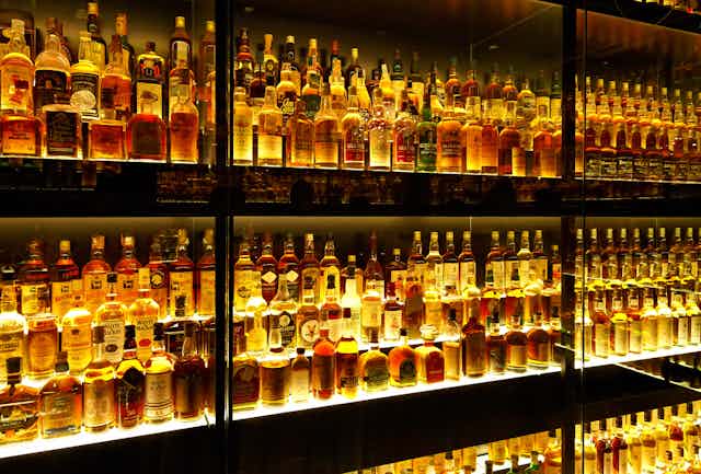 Rows of specialist whiskies on a gantry.