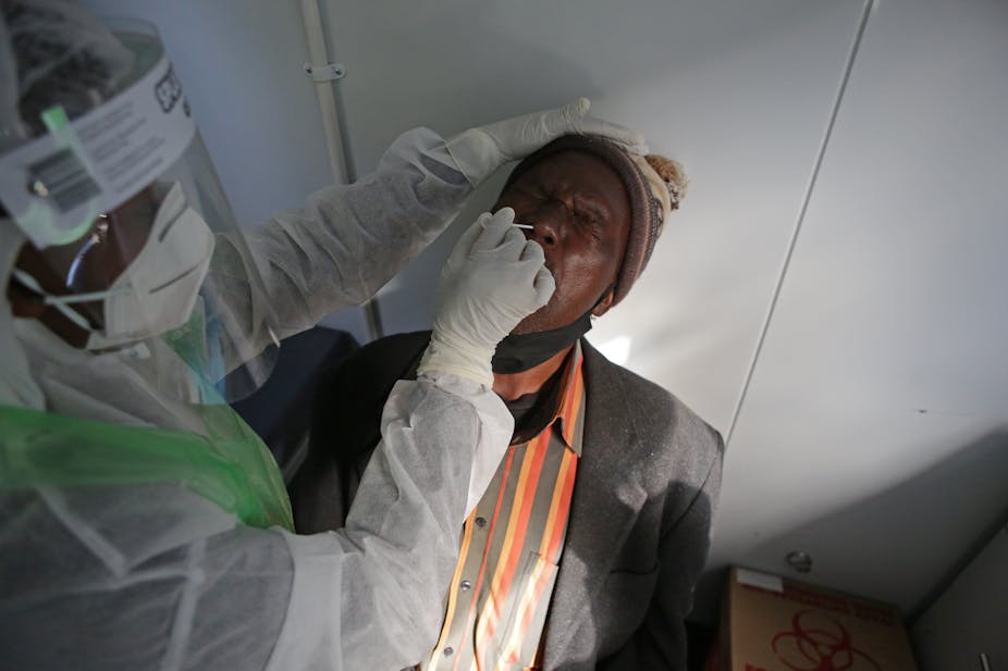 A man gets a nasal swab to test for the COVID-19