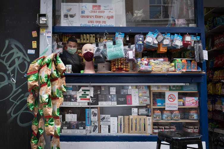 A shopowner with his goods.