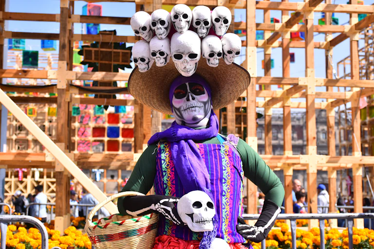 A woman with her face painted as a skeleton takes part in Day of the Dead celebrations in Mexico City