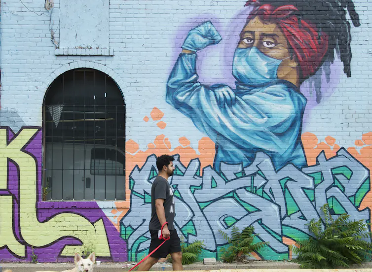 A man walking his dog.