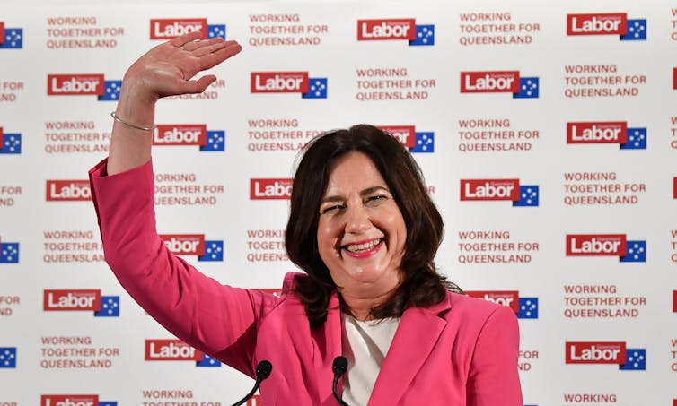 Queensland Premier Annastacia Palaszczuk waving, claiming victory