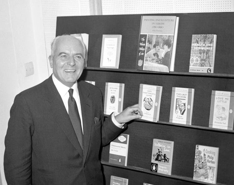 Man with display of paperback copies of Lady Chatterley's Lover.