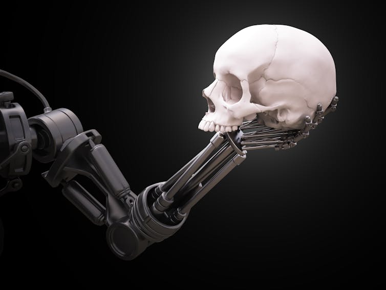 A robotic arm holding a human skull