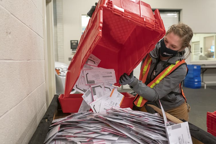 Postal worker with election ballots