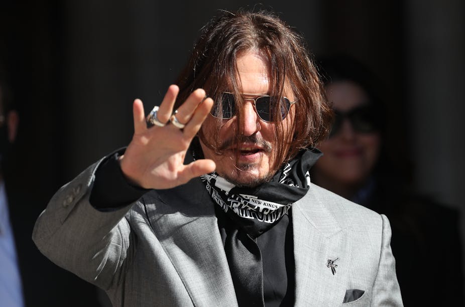 US actor Johnny Depp waves to fans.