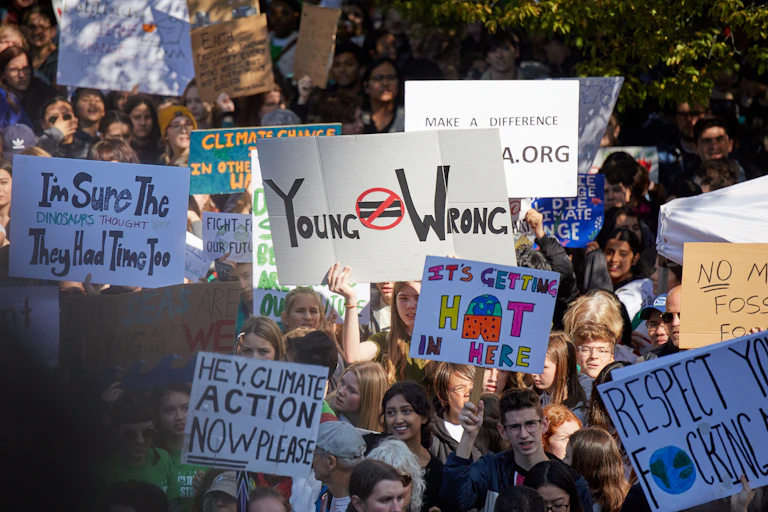 Protesters holding signs