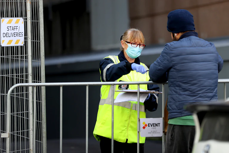 Police checking a person in COVID-19 quarantine.