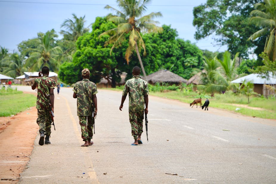Soldiers from the Mozambican army patrol the streets after security in the area was increased, following a two-day attack from suspected islamists in October last year, on March 7, 2018 in Mocimboa da Praia, Mozambique