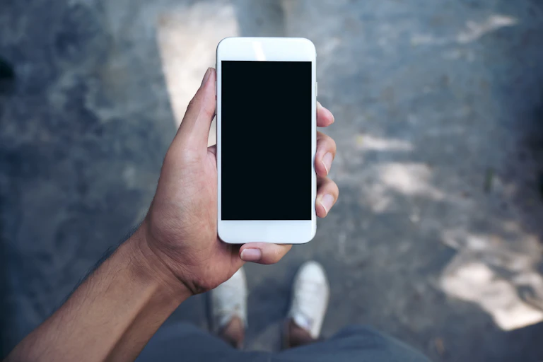 Man holding a smartphone with one hand.