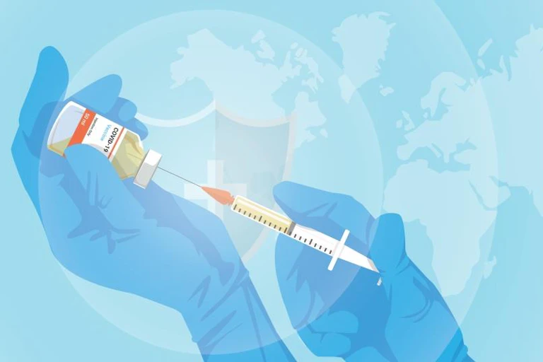 Illustration of gloved hands drawing up COVID vaccine into syringe against global map background