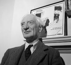 Black and white photo of man in suit and tie