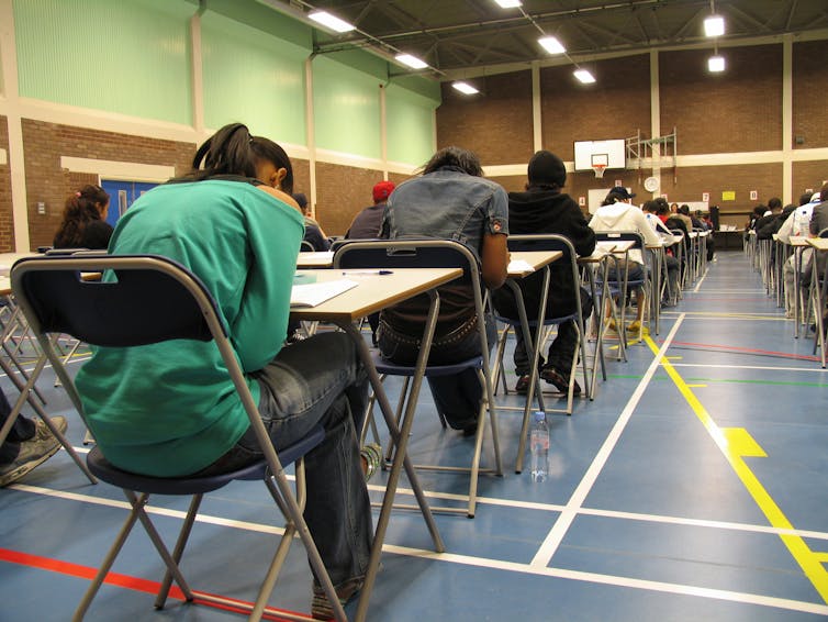 Students writing an exam.