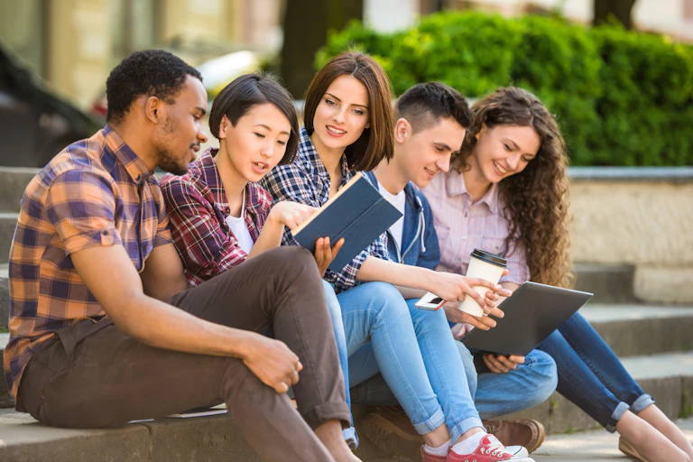 Group of students sitting on steps