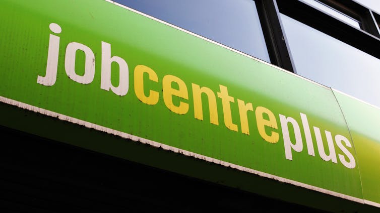 Job Centre Plus sign shot from below.