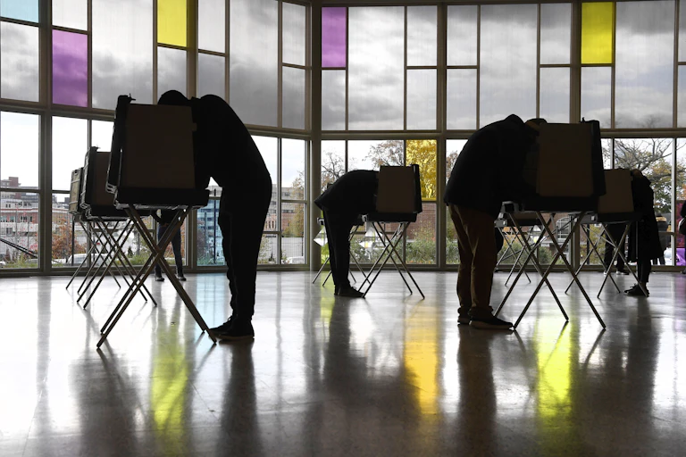 Voters mark their ballots at First Presbyterian Church on Election Day, Tuesday, Nov. 3, 2020, in Stamford, Conn.