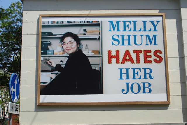 Melly Shum Hates Her Job' but Europeans love this work by Canadian artist  Ken Lum