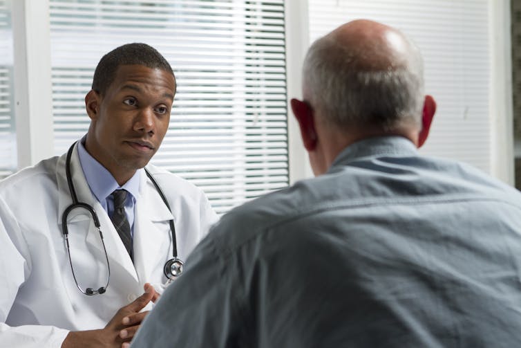 A doctor and a patient have a chat.