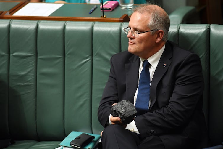 Scott Morrison holds a lump of coal