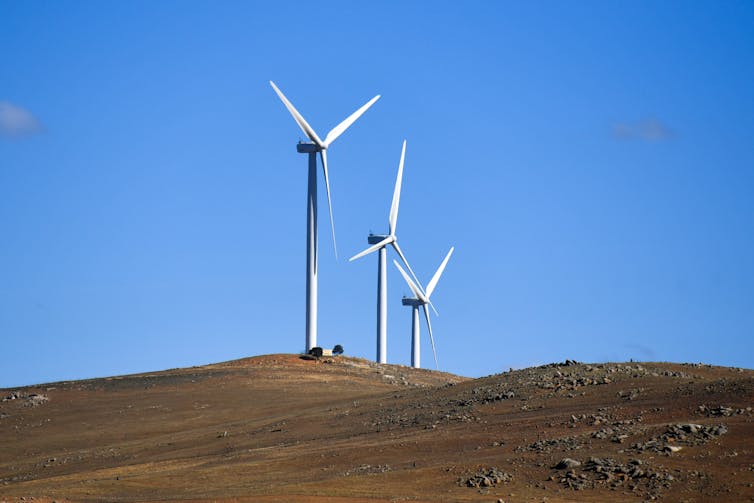 Wind turbines against a blue sky