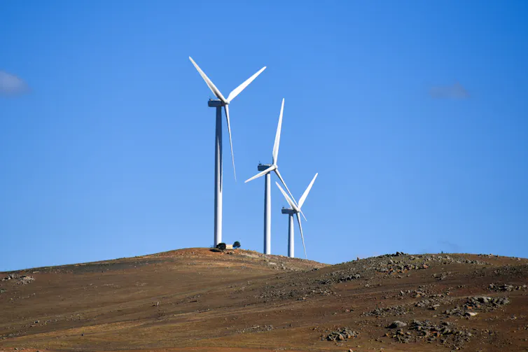Wind turbines against a blue sky