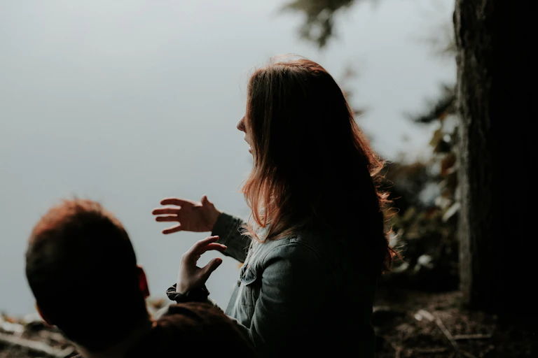 Woman speaks and gestures with hands