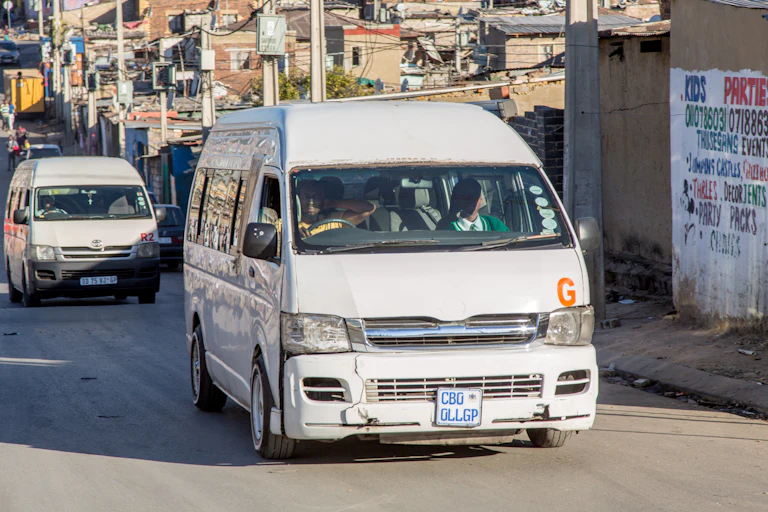 Minibus taxis on the road in an urban setting
