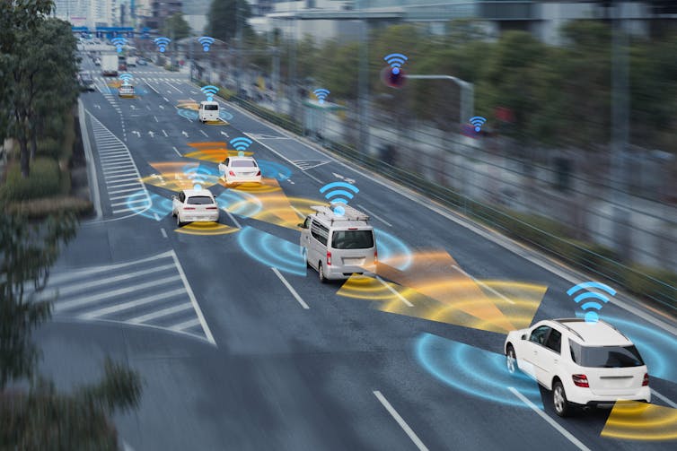 Cars driving on busy road with symbols representing their connection to the internet